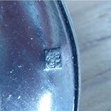 2 small white metal spoons