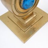 Pair of brass candlesticks decorated with a blue stone inlaid in the center