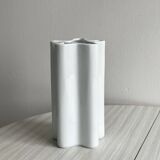 Modern white ceramic vase with wavy curves