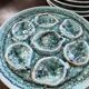 Set of 12 plates and an oyster dish or other in majolica.