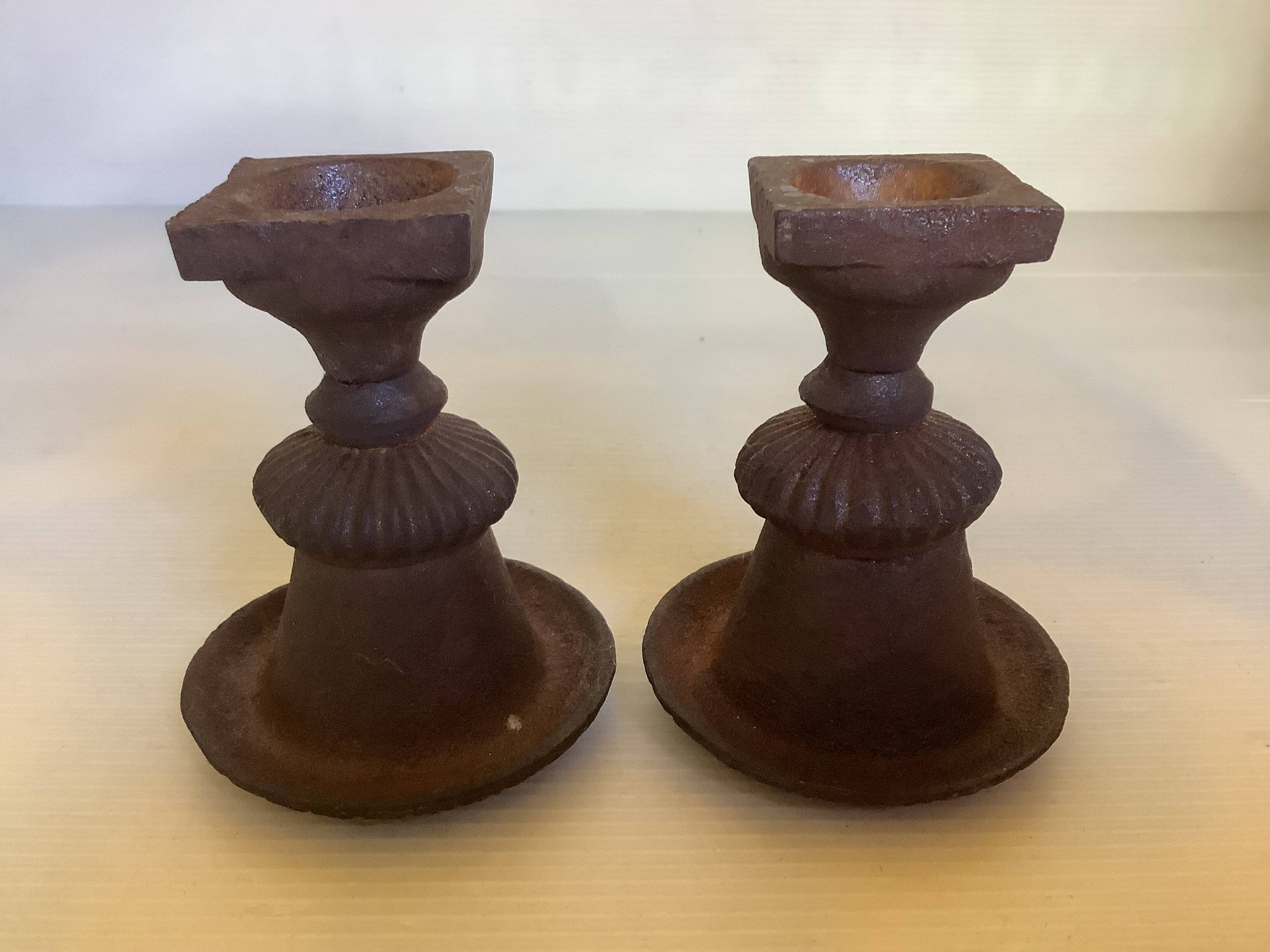 Pair of Médicis vase candlesticks in cast iron