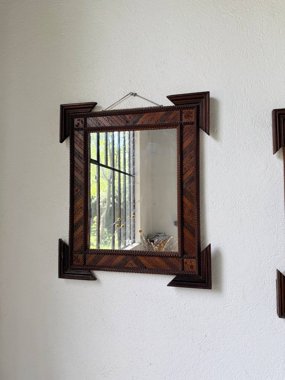 Pair of wooden mirrors in tramp art style