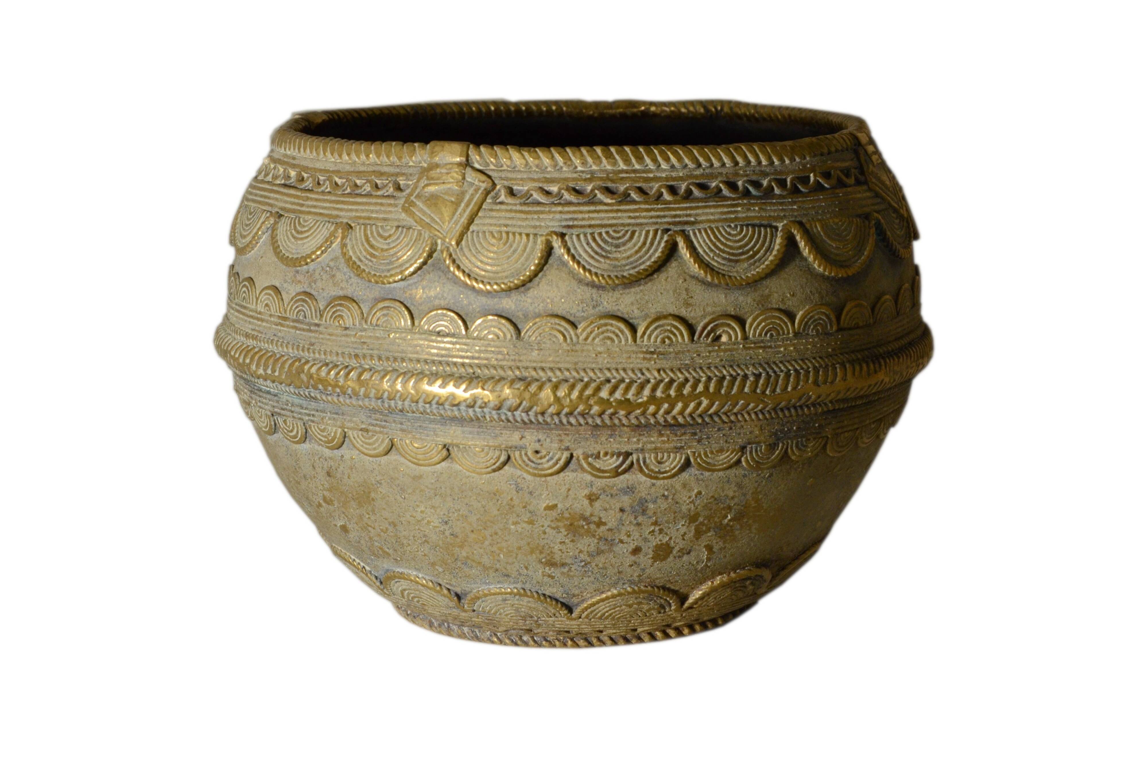 Ancient bronze ethnic pot, handcrafted in India.