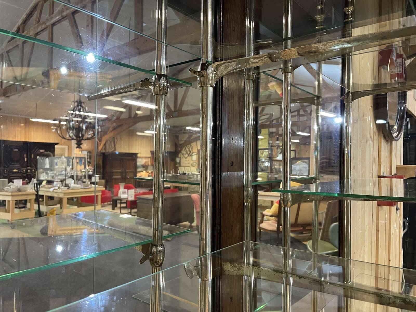 Early 20th-century shop display cabinet in oak with sliding doors.