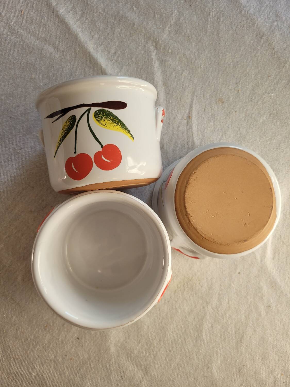 Glazed earthenware terrines with cherries