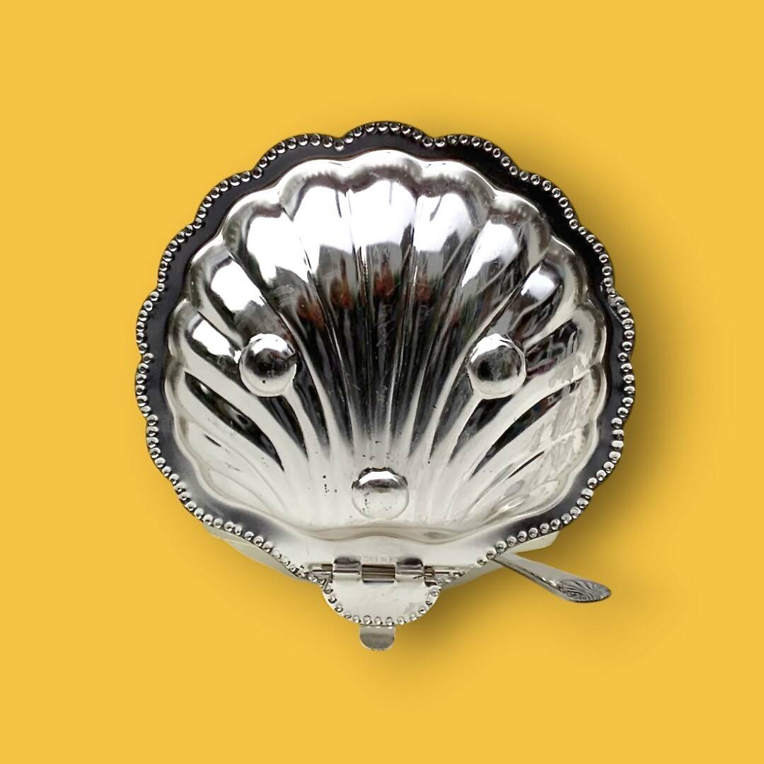 Vintage silver-plated metal and glass shell butter dish with knife