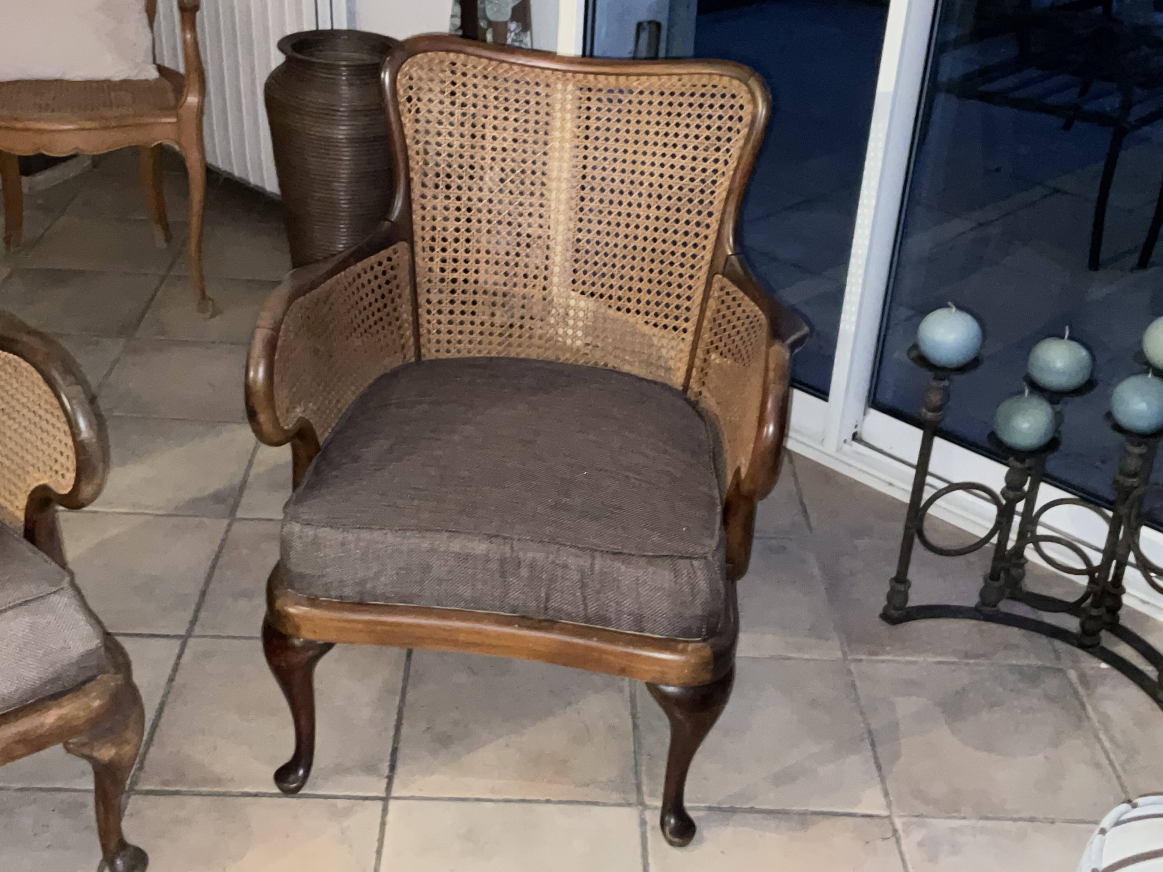 Chair with cane back and recently reupholstered fabric seat.