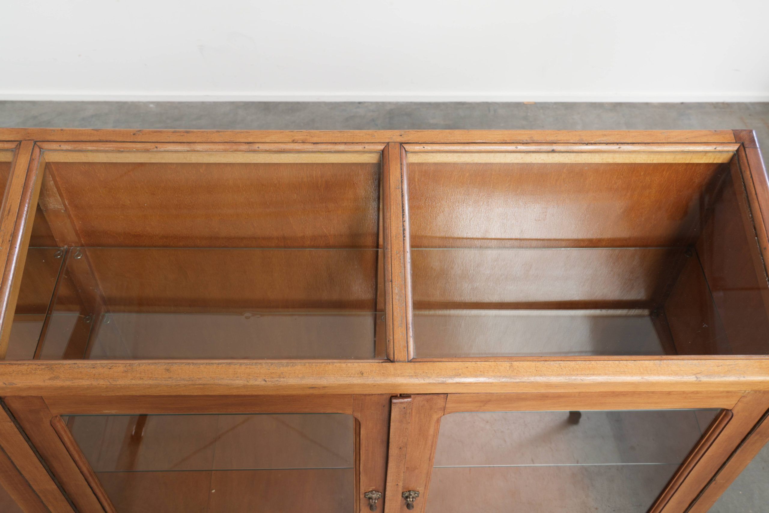 Vintage wooden counter / display cabinet / museum cabinet with warm colours