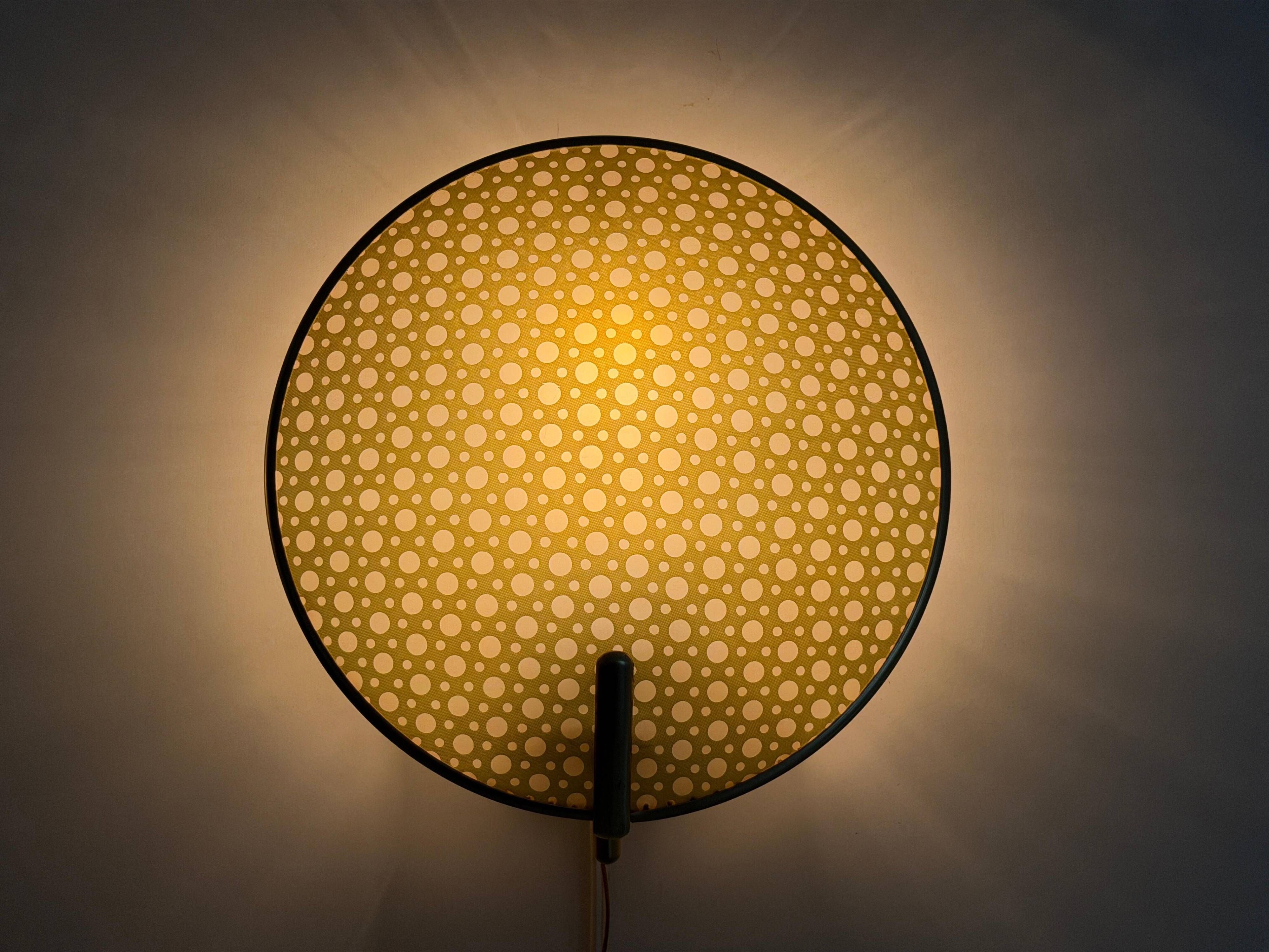 Pair of green plexiglass and gold metal wall lights by Erco, 1950s, Germany.