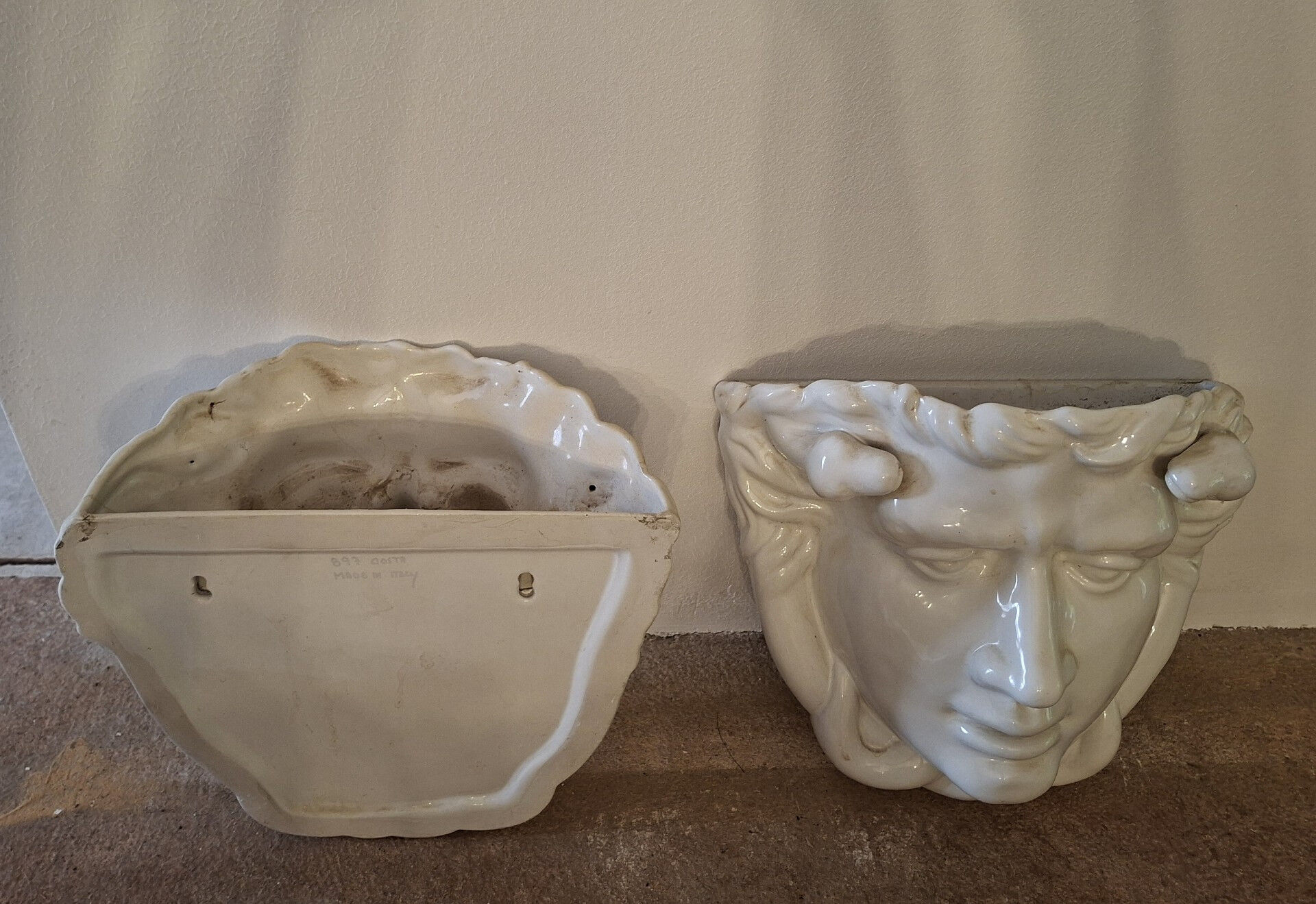 Pair of white glazed ceramic wall planters