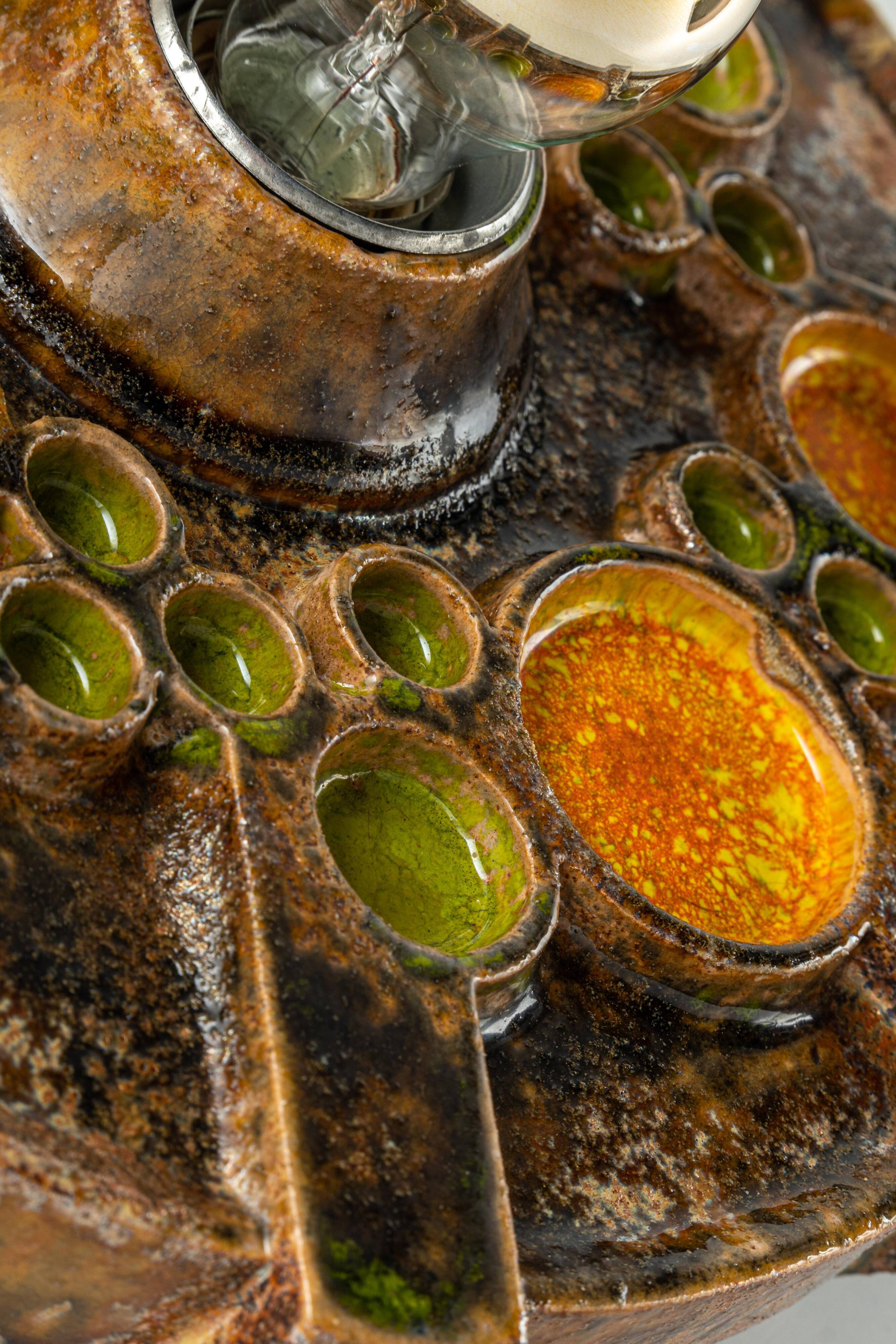 Sputnik wall lamp in brown and orange ceramic, Germany, 1970s.