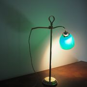 Desk lamp in brass with a swan neck and green opaline glass.