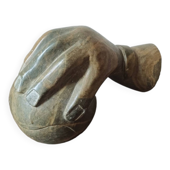 Signed sculpture. Hand placed on a stone/marble ball