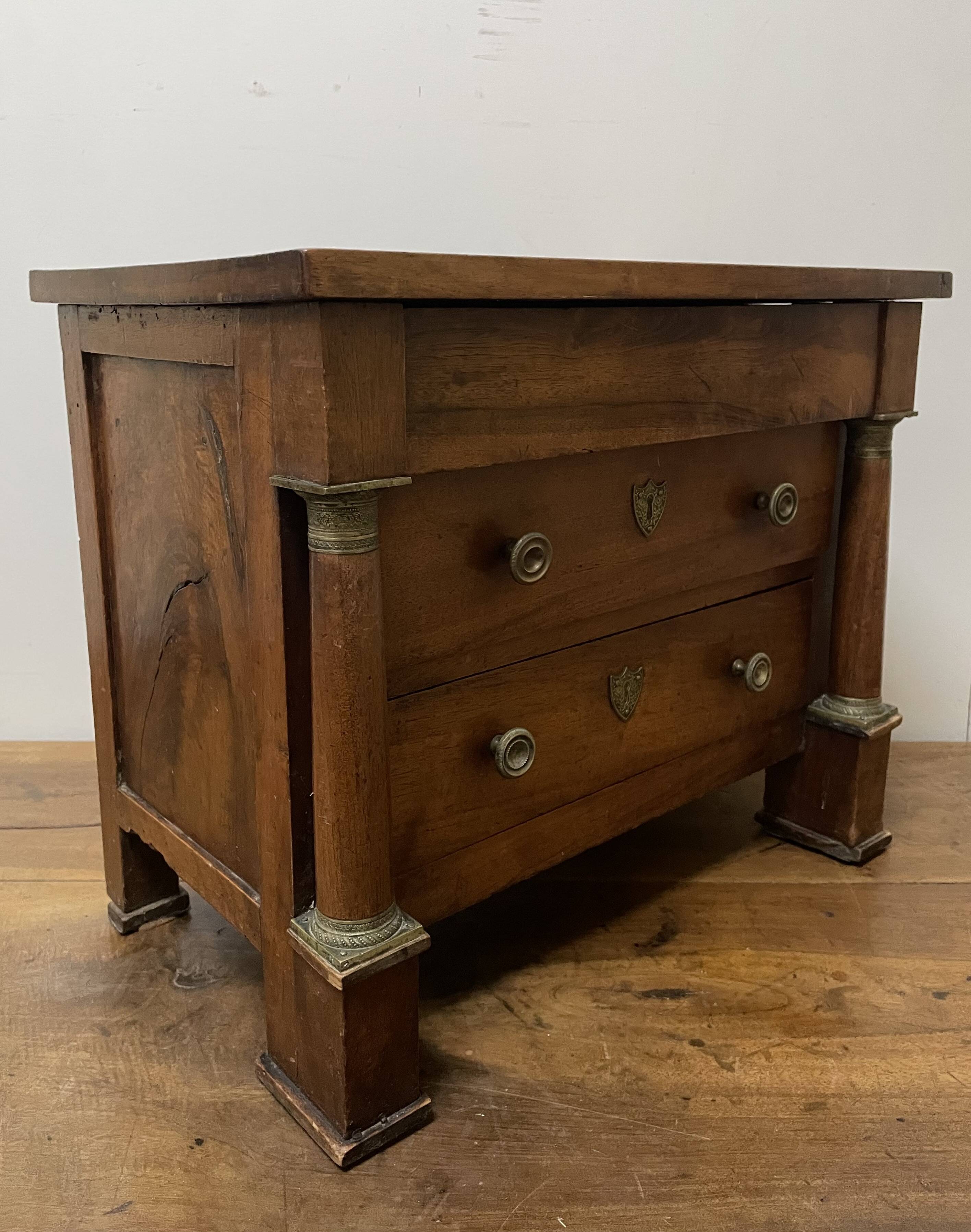 19th century Empire style walnut chest of drawers. It opens with 3 drawers in