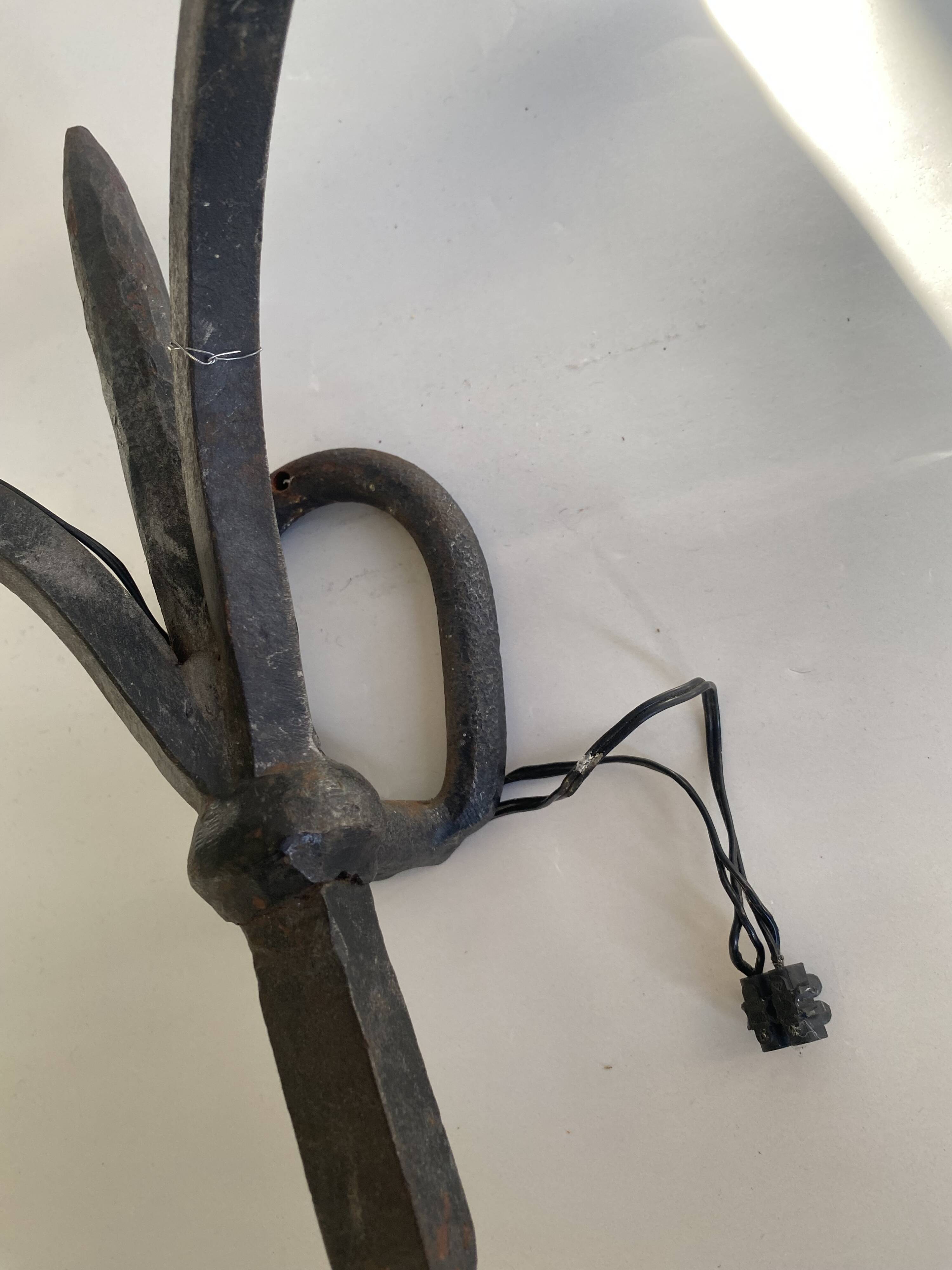 Wrought iron wall lights.