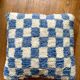 Sky blue and white checkered wool cushion