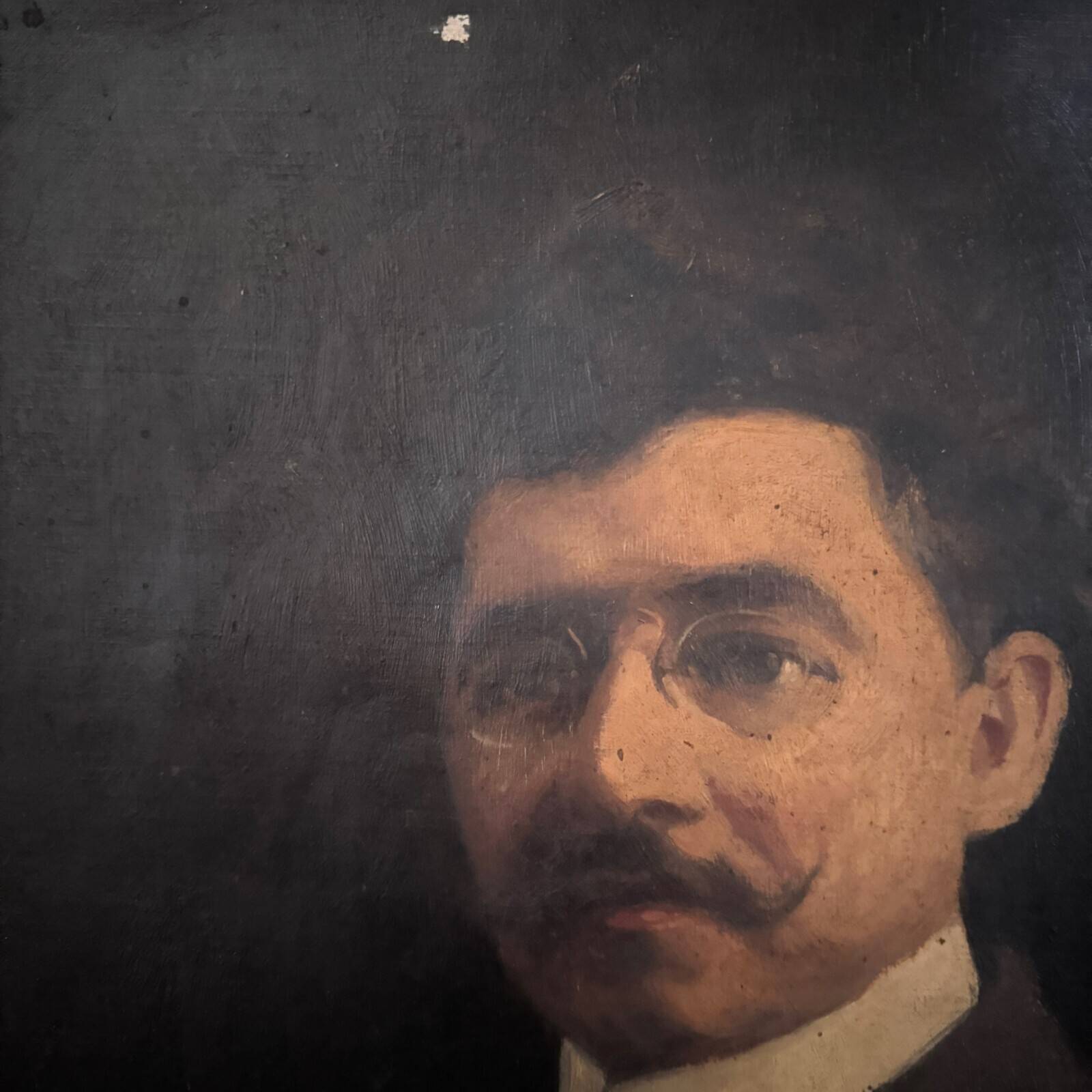 Oil on canvas portrait of a man wearing glasses and a mustache, early 20th century