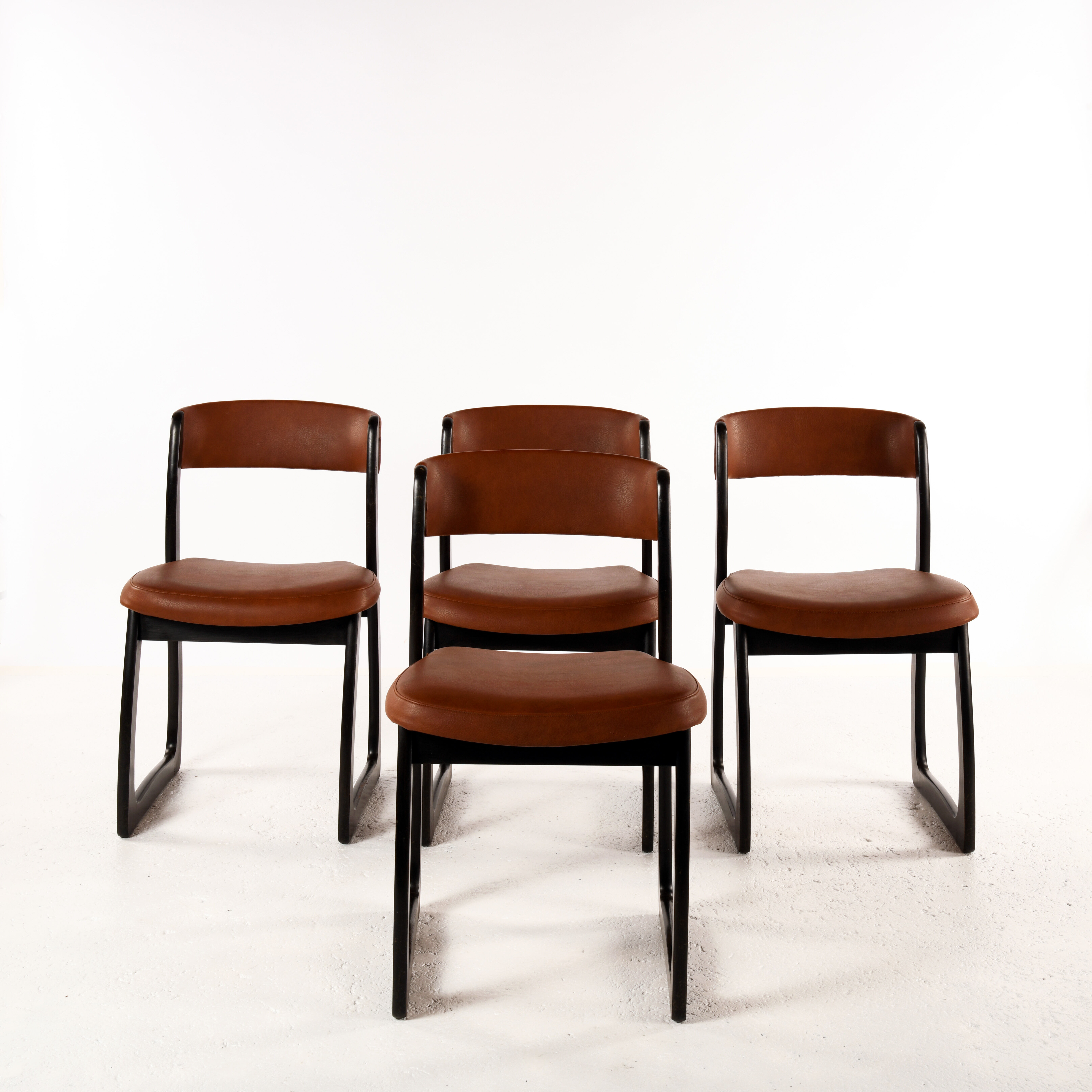 Set of 4 vintage wood and skai sled chairs