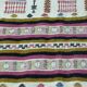 Handmade Berber kilim rug with multicoloured tribal motifs.