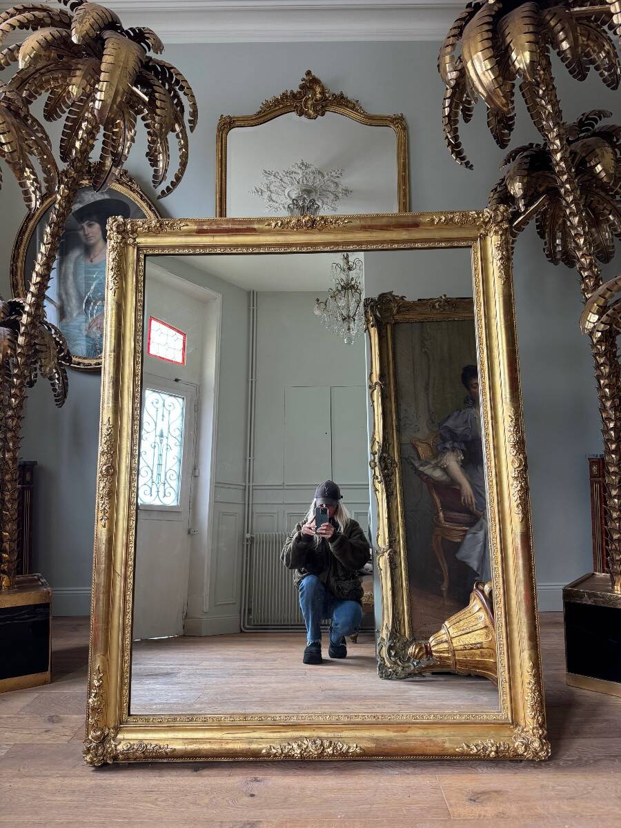 Restoration period mirror in gilded wood from the Napoleonic III era, 165 cm x 130 cm.