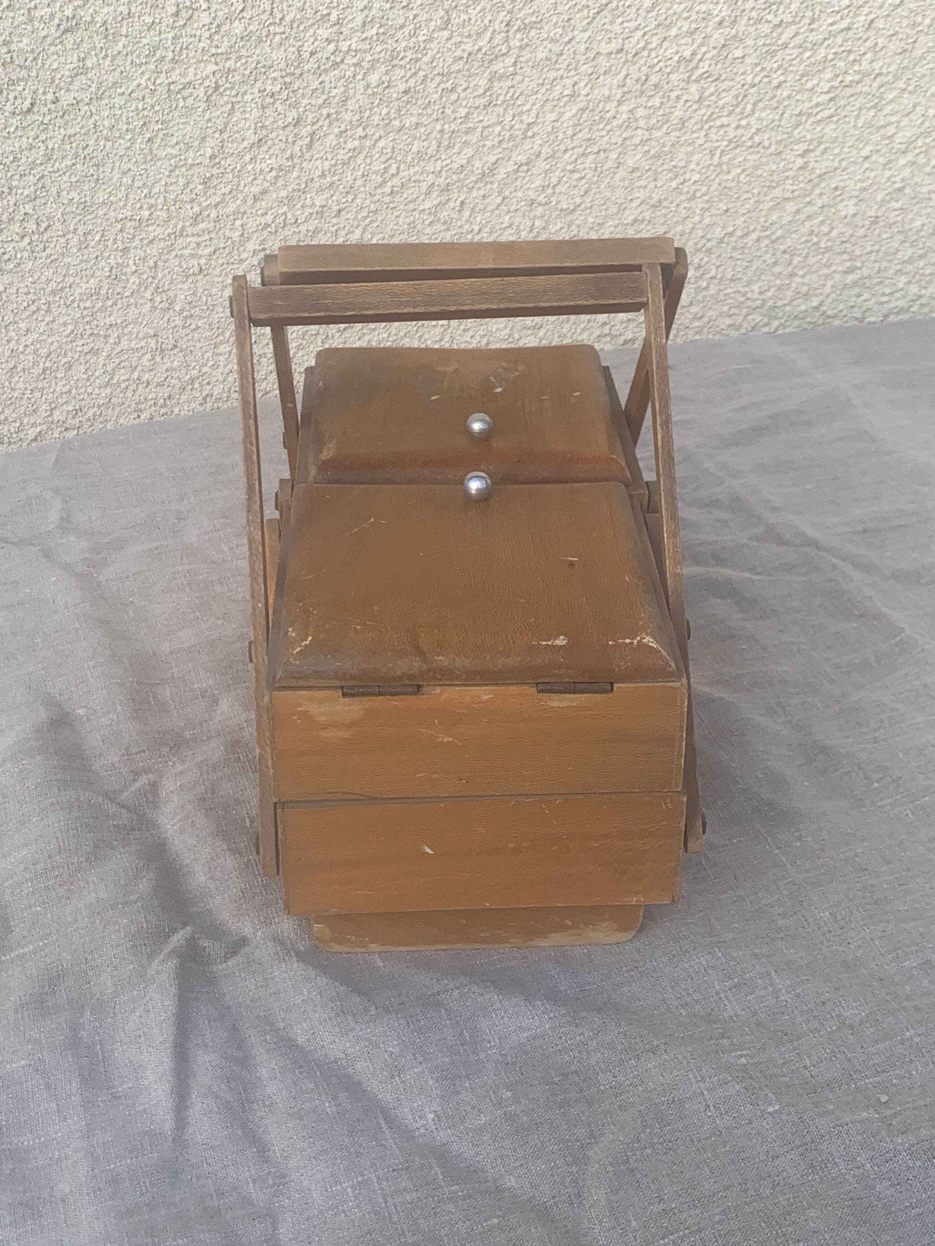 Sewing box in old varnished wood