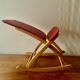 Vintage rocking footstool in red Skai and wood