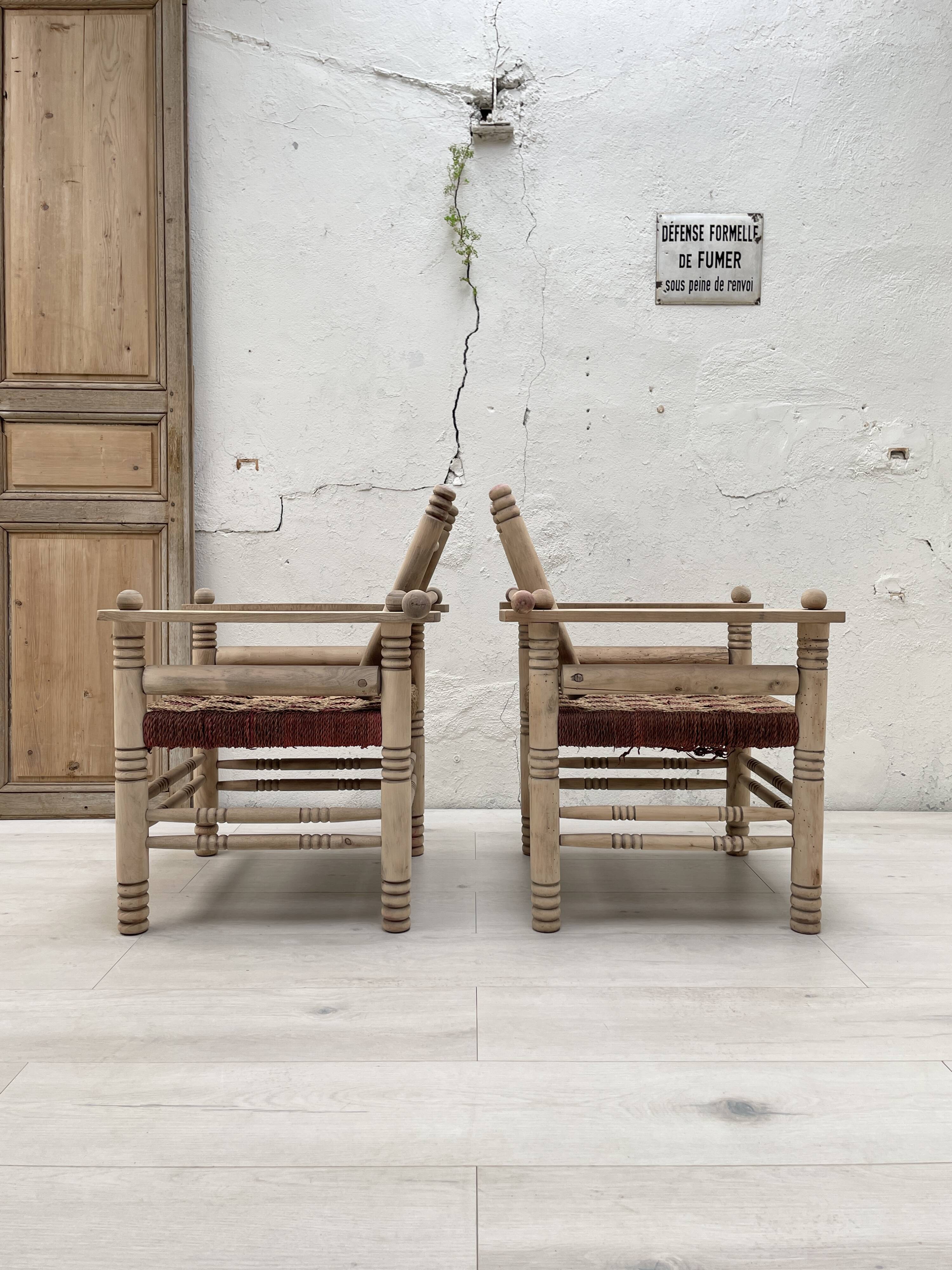 Pair of wooden armchairs and ropes