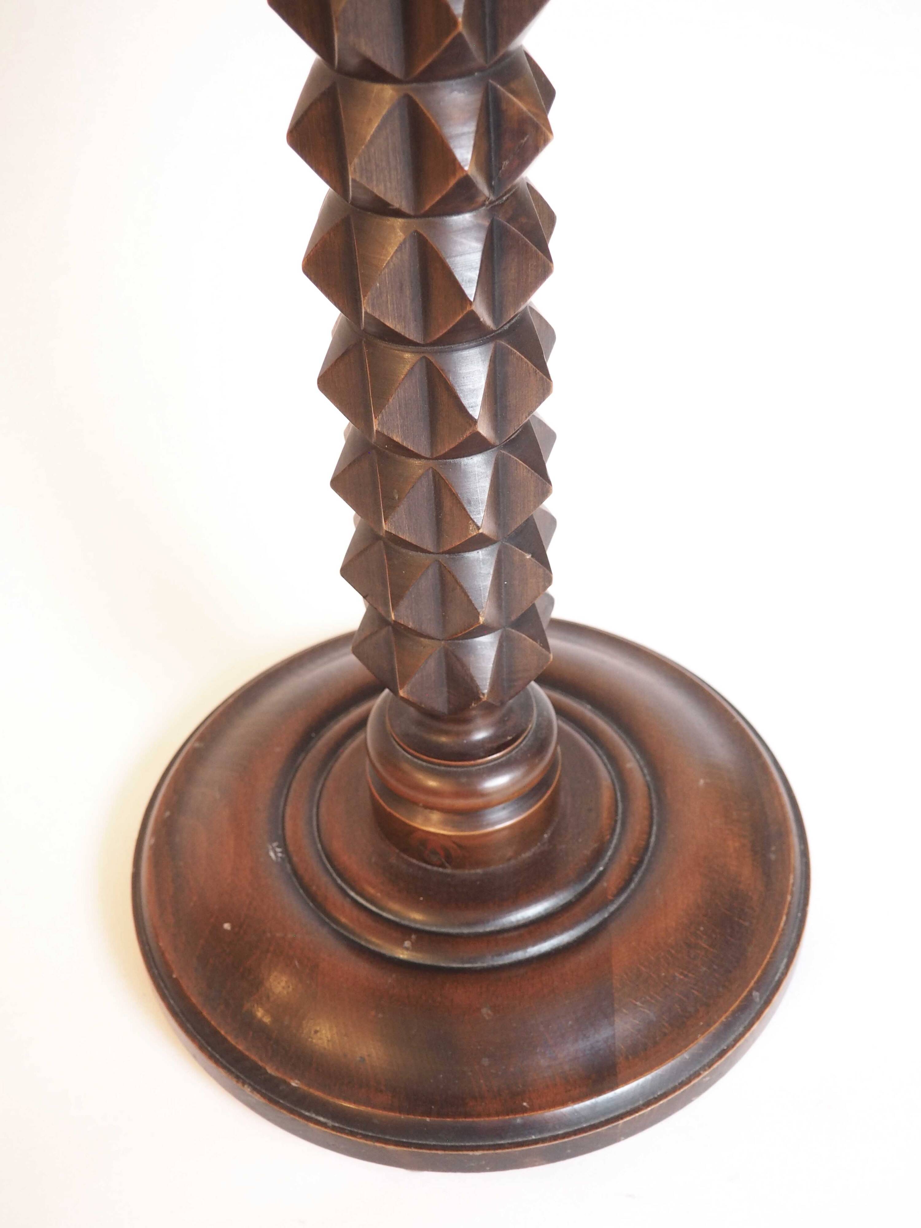 Wooden pedestal table with spiked columns