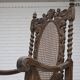 Fauteuil danois à haut dossier des années 1930, en maille, velours et bois de chêne sculpté.