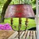 Bronze-gilt bouillotte lamp XIXth century with a tin shade featuring Japonese decoration.