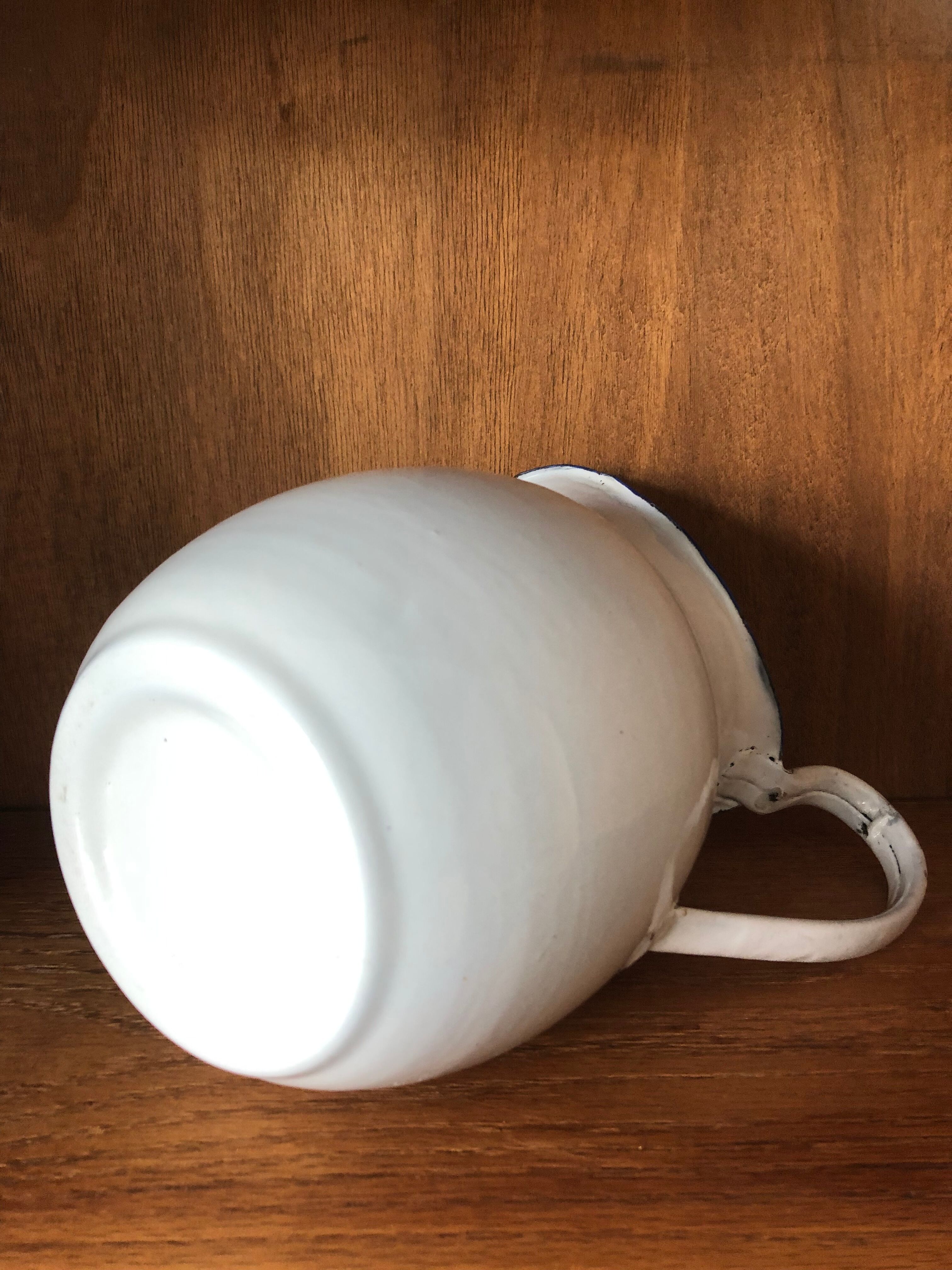 Enamelled plate pitcher