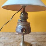 Repoussé brass lamp with floral motifs, decorated with 3 miniature medallions