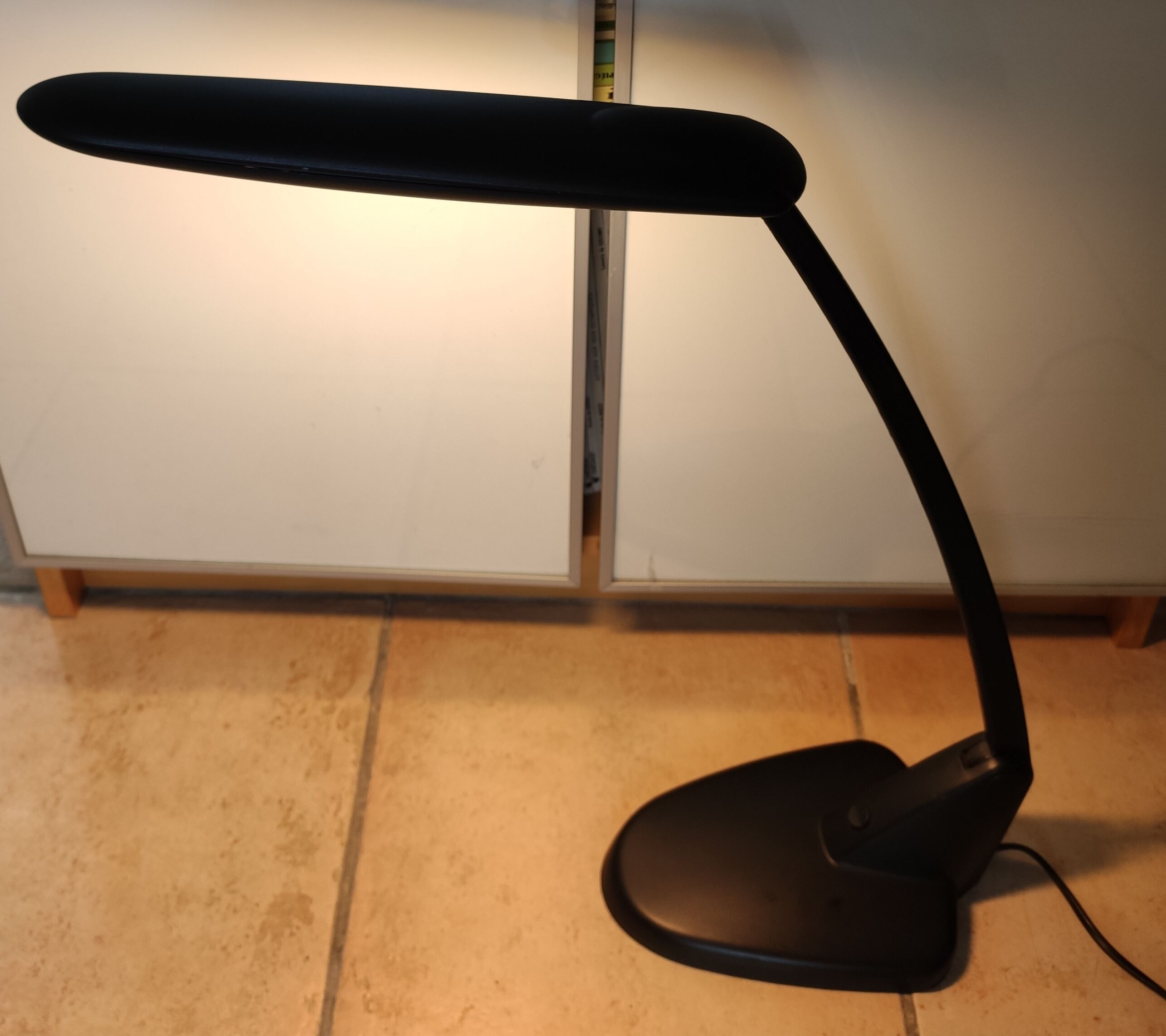 Black unilux workshop lamp with articulated arm