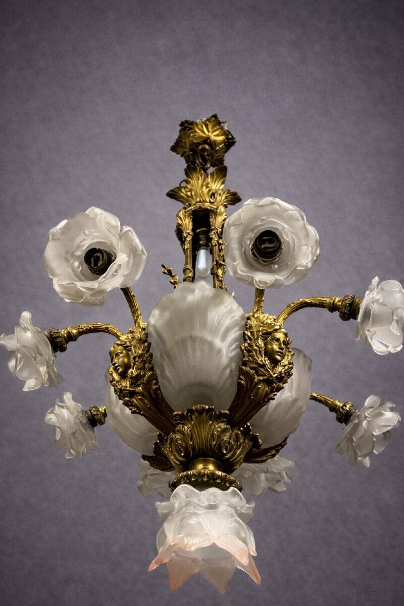 Rare and important gilded bronze chandelier with shells and roses.
