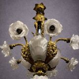 Rare and important gilded bronze chandelier with shells and roses.