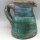 Vintage broc pitcher in enamelled sandstone with effect of blue shades, turquoise green signed