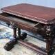 Ancient Flemish Gothic desk. Solid oak with richly carved dolphins.