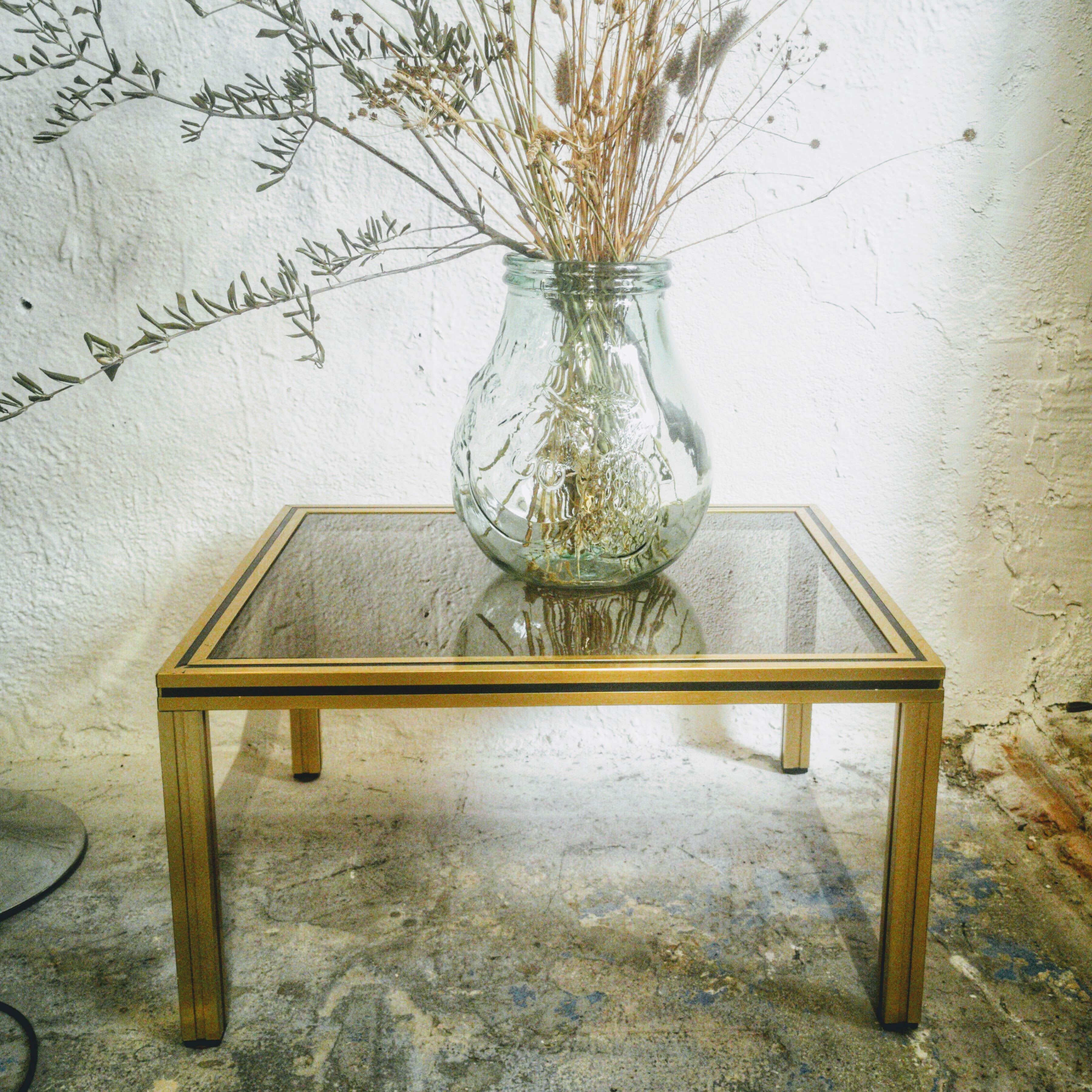 Gold metal side table and smoked glass