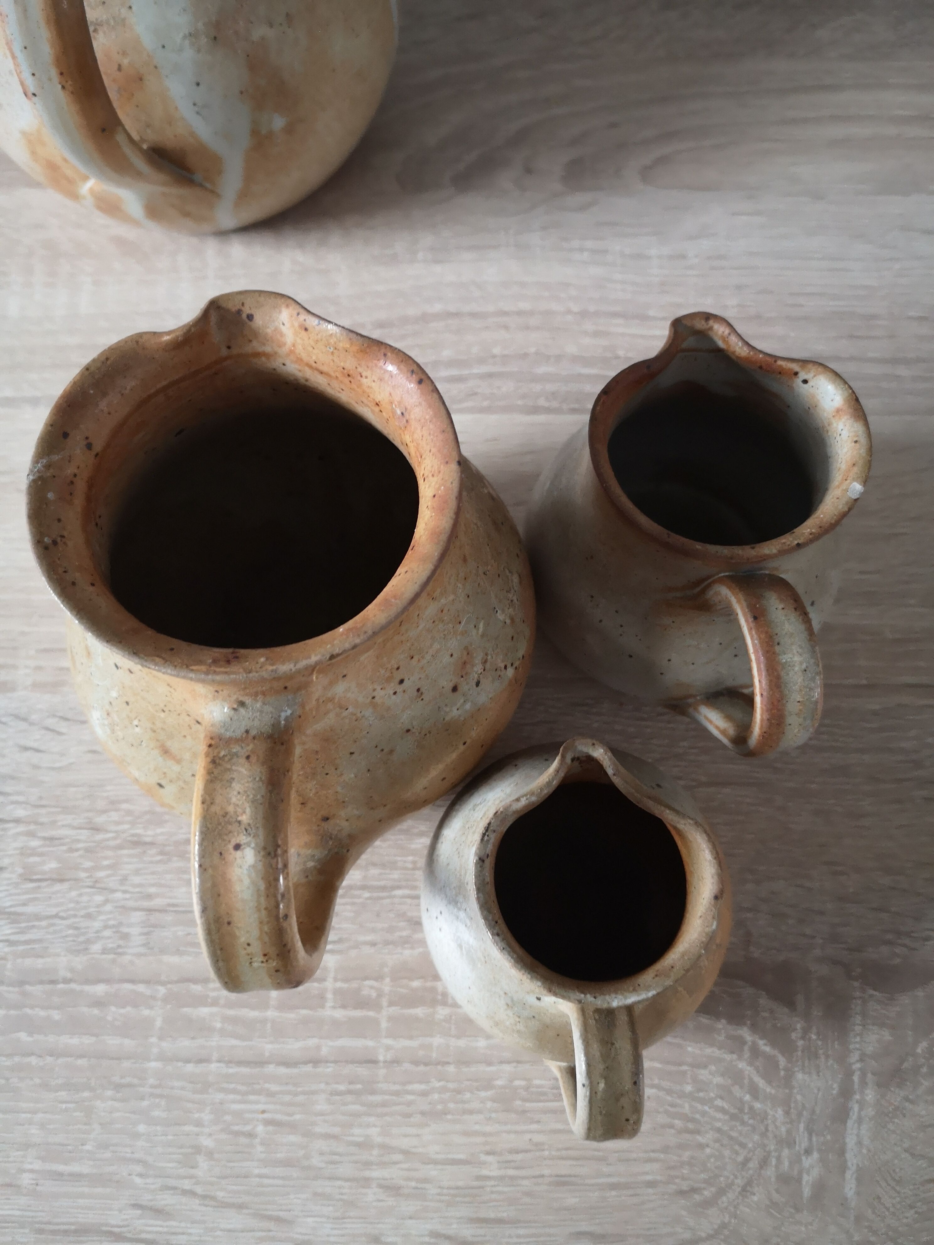 Lot of 4 pitchers in sandstone