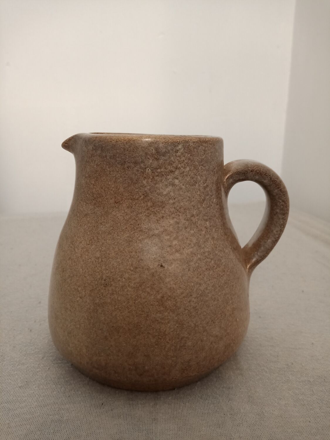 Signed stoneware milk jug