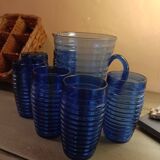 Orangeade carafe service and 6 glasses in a wicker basket