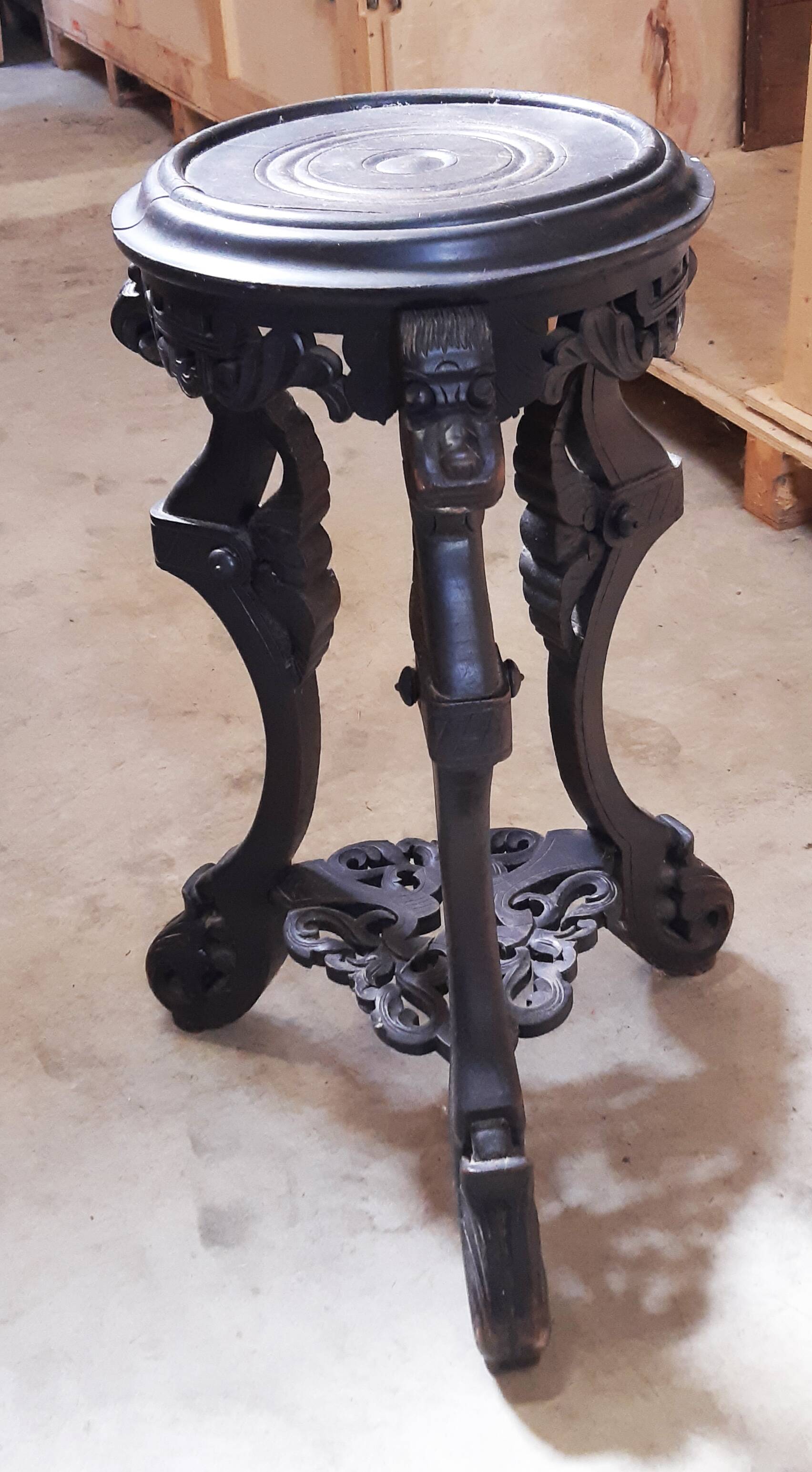 Antique carved side table with Indochinese inspiration, made of blackened wood