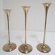 Trio of brass scandinavian candlesticks