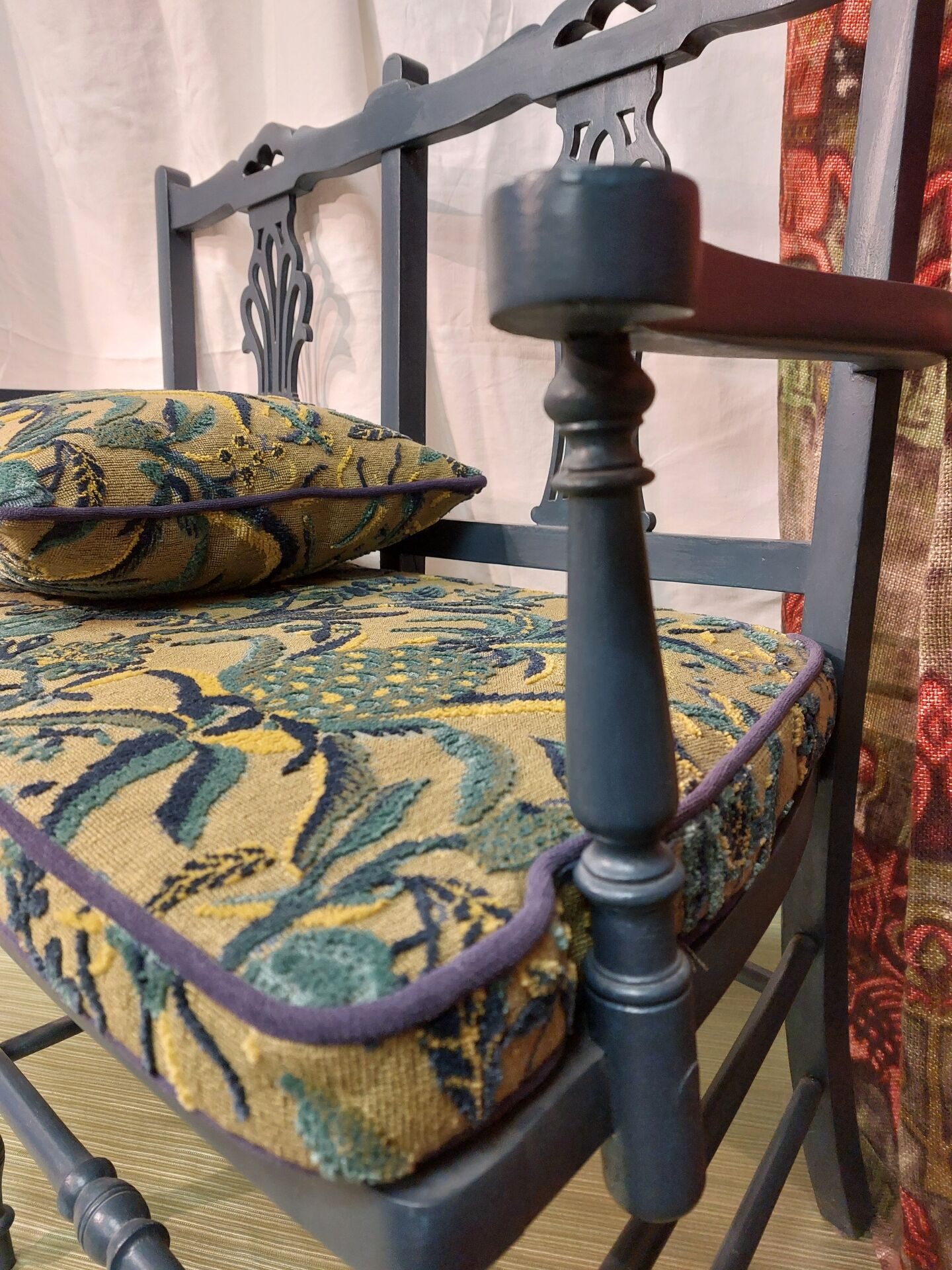 Pretty painted and upholstered bench in green and blue.