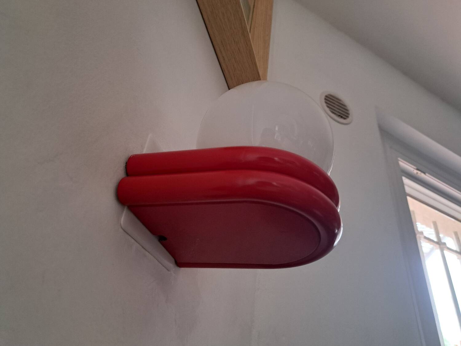 Red metal globe wall light