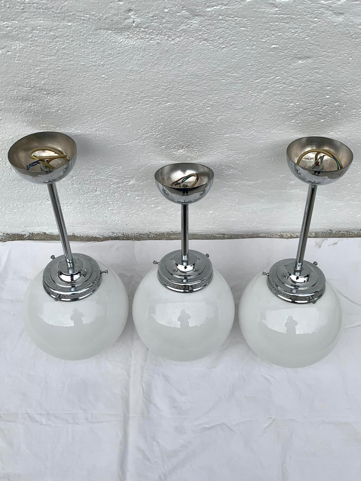 Glass and aluminum globe hanging lamp