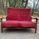 Vintage 2-seater sofa in solid wood and burgundy velvet from the 20th century