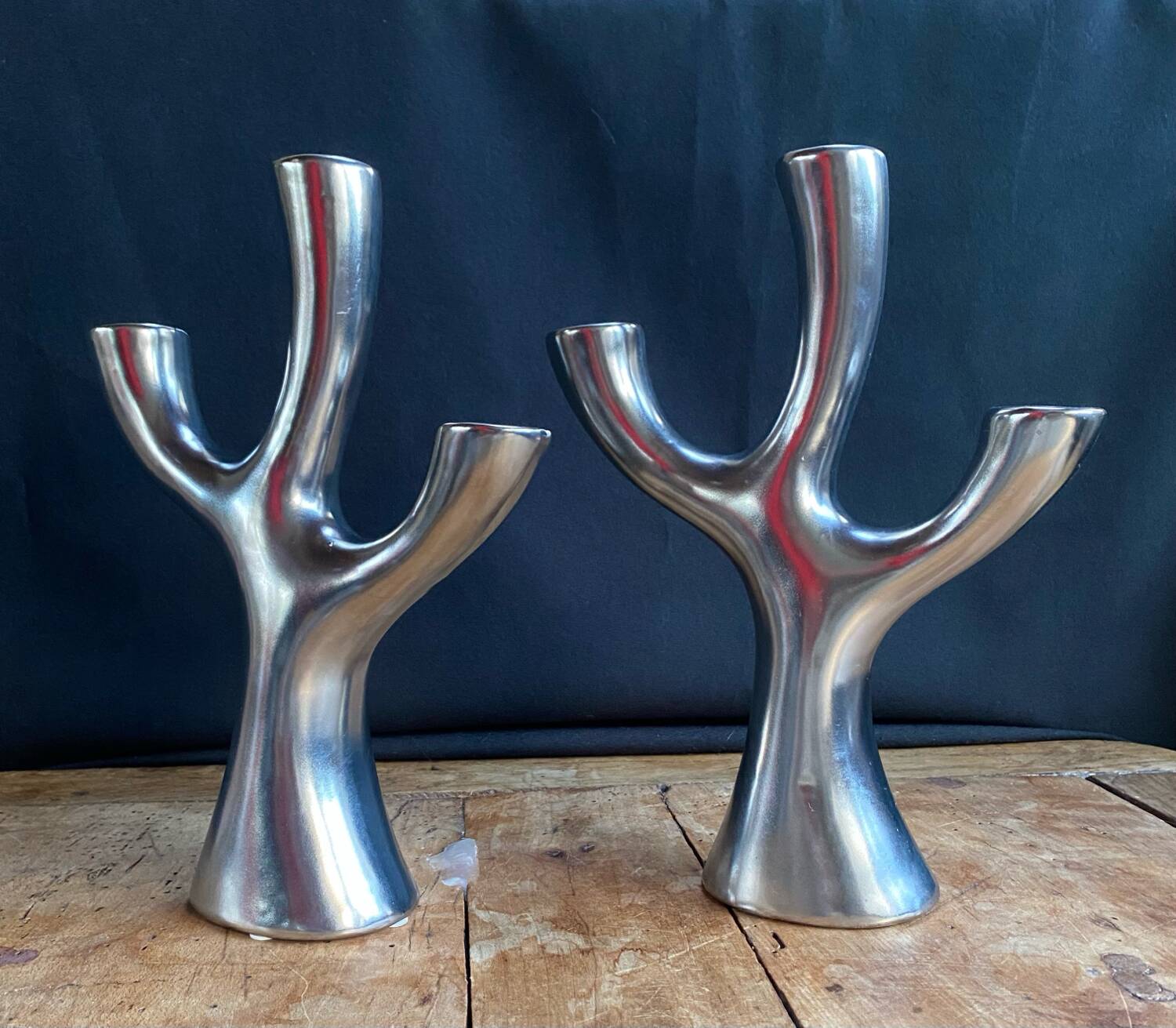 Silver candlesticks in the shape of a 3-branch tree