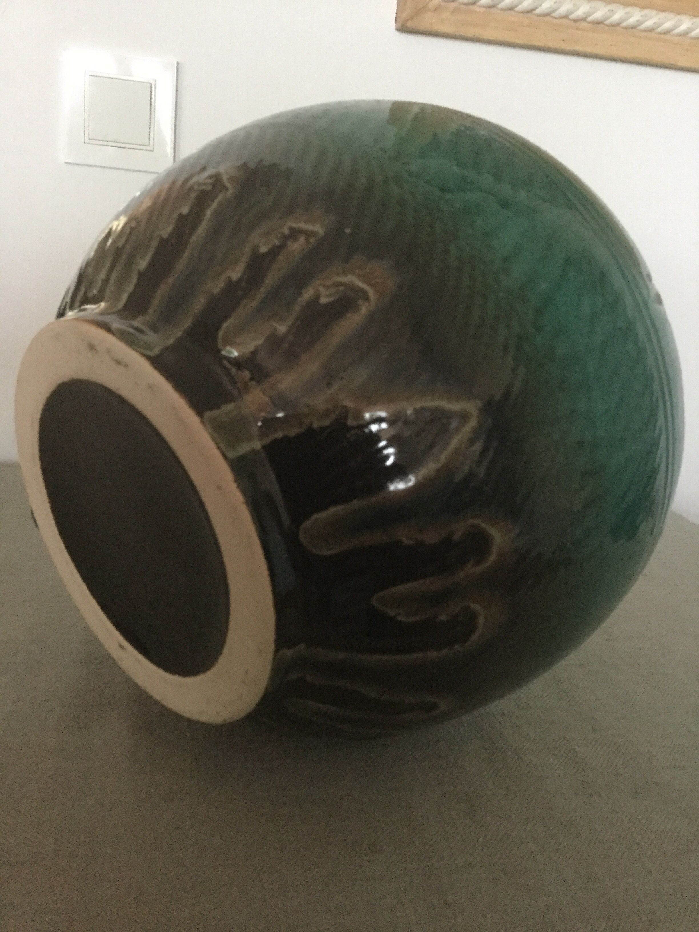 Green earthenware vase base with black flame decoration