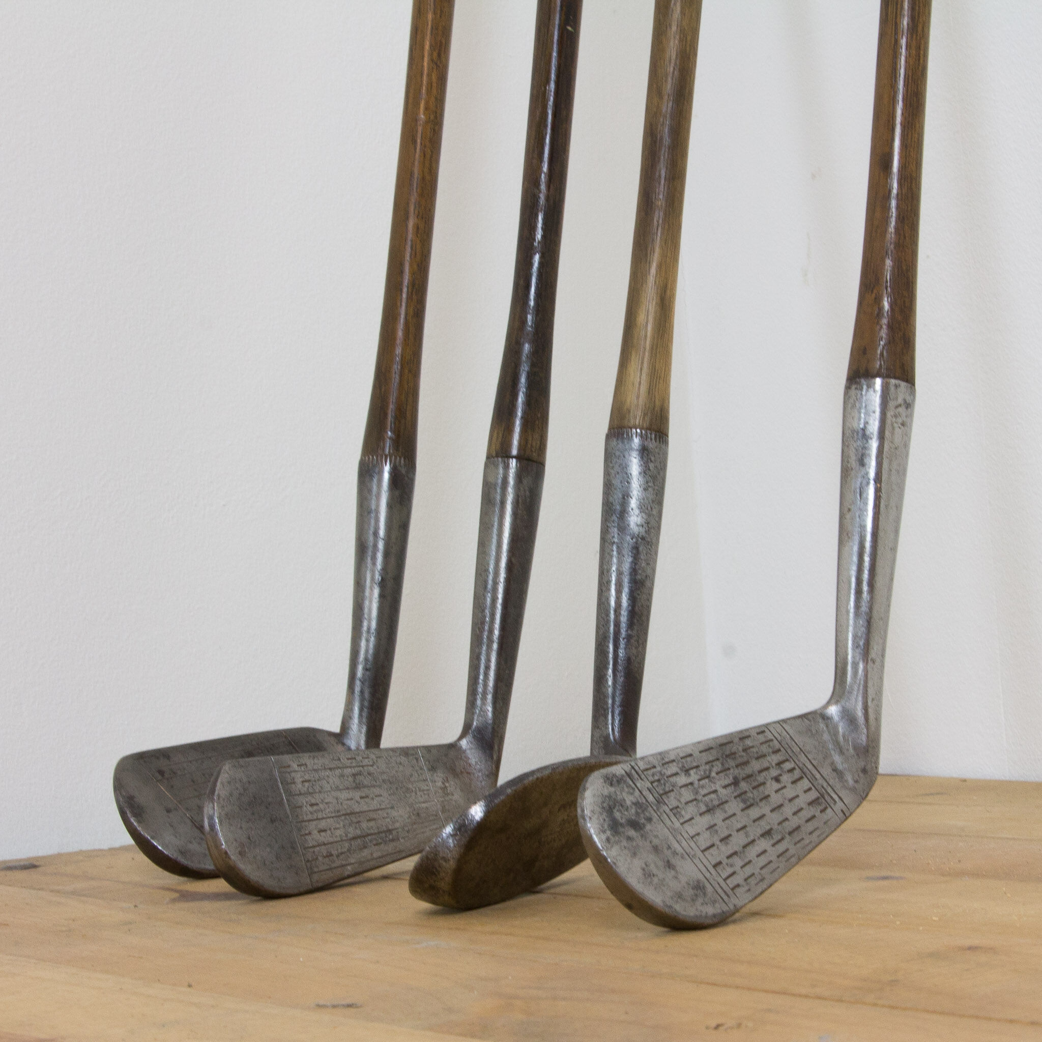 Set of 4 polished vintage golf clubs